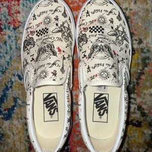 Vans Cream Slip-On Shoes with Black Graphic Design